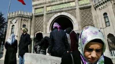 Turkish women gather in front of Istanbul University in support of the right to wear head scarves in classrooms and on campus.