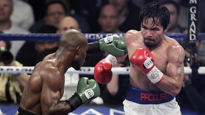Manny Pacquiao measures up Timothy Bradley in 2014. AFP