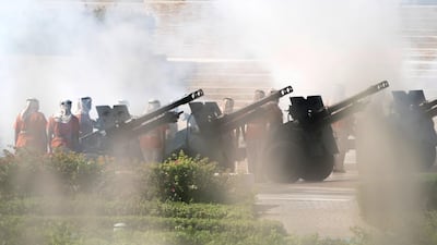Members of the UAE Armed Forces perform a twenty-one gun salute.