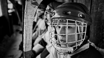 In this image released by World Press Photo titled “Vetluga’s Hockey” by photographer Vladimir Pesnya which won the first prize in the Sports Stories category shows a player from the junior team from the village Sharanga expected to yield to the ice in Vetluga, Russia, Feb. 19, 2015. Vetluga’s hockey players of an amateur team in provincial Russia are photographed before, during and after a game in the regional championship in Vetluga, Nizhny Novgorod Oblast, Russia. Vladimir Pesnya / World Press Photo via AP