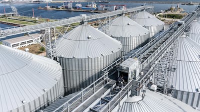 A worker walks along a bridge on top of a new complex of grain silos at the Port of Constanta in Constanta, Romania.