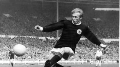 Denis Law, pictured here taking a shot against England at Wembley in 1967, won 55 Scotland caps between 1959-1974.