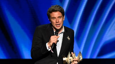 Jonathan Anderson accepts his Designer of the Year award