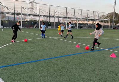 Young women practice football drills at Onyx football club. Photo: Onyx FC