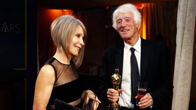 Roger Deakins holds the Oscar for Best Cinematography for "1917" as he and his wife Isabella James Purefoy Ellis attend the Governors Ball after the Oscars on Sunday, February 9, 2020, at the Dolby Theatre in Los Angeles. Reuters