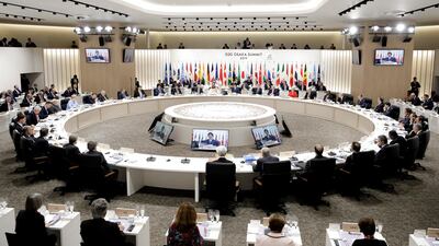 The G20 leaders listen during a working lunch. AP