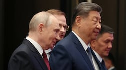 Russian President Vladimir Putin and Chinese President Xi Jinping arrive for a family photo before a session of the Shanghai Co-operation Organisation summit in Bishkek, Kyrgyzstan on Tuesday. Reuters