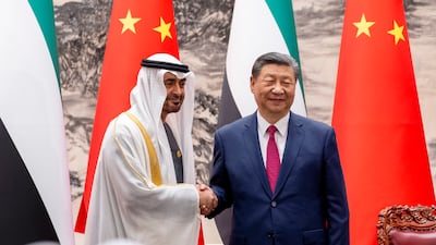 Sheikh Mohamed and Mr Xi witness the exchange of deals between their countries.