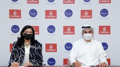 Najla Al Midfa, chief executive of Sheraa, and Adil Al Ghaith, Emirates' senior vice president, commercial operations, Gulf, Middle East and Central Asia, while signing the agreement. Courtesy Emirates