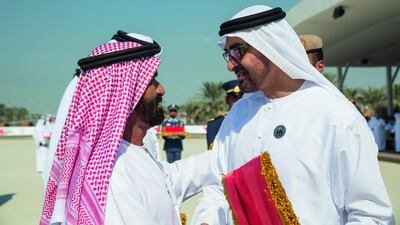 Sheikh Mohammed bin Zayed, Crown Prince of Abu Dhabi and Deputy Supreme Commander of the Armed Forces, presents a Martyr’s Medal of Honour to a relative of a Armed Forces martyr who sacrificed his life while serving the UAE. Ryan Carter / Crown Prince Court of Abu Dhabi