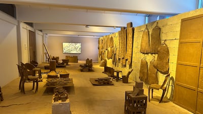 The exhibition by Sandra Poulson transforms what used to be a classroom into a marketplace decked with goods and produce all created from recycled cardboard