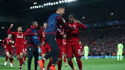 Divock Origi, right, celebrates scoring Liverpool's fourth goal in their win over Barcelona. Getty