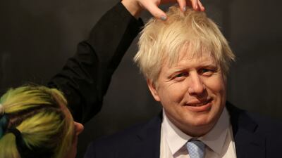 A waxworks artist adds finishing touches to a Boris Johnson waxwork figure unveiled on Tuesday at Madame Tussauds in Blackpool. Reuters