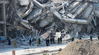 Rescuers work at the site of a high-rise building under construction that collapsed after a 7. 7 magnitude earthquake in Bangkok, Thailand. AP