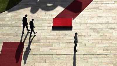German Chancellor Friedrich Merz, left, and Canada's Prime Minister Mark Carney walk during a welcoming ceremony in the courtyard of the Chancellery in Berlin. AFP