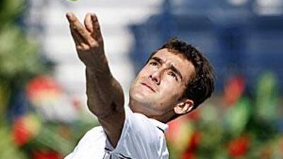 The Croatian Marin Cilic shows his power as his serves the ball to Arnaud Clement.