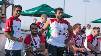Majid Al Balooshi, second left, on the sidelines during the UAE's recent warm-up match against the Conference Barbarians. Victor Besa for The National