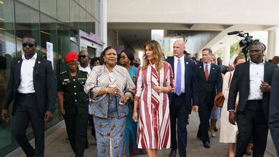 Melania Trump and Ghana's first lady Rebecca Akufo-Addo walk to their vehicles as they leave Greater Accra Regional Hospital in Accra, Ghana. AP Photo