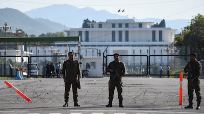 Police guard a road leading to the Pakistani President's residence, as Islamabad prepares for proposed talks between the US and Iran. Reuters