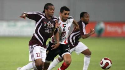 Al Wahda's Pinga, left, challenges Al Jazira's Rashed Abdulrahman for the ball in a corresponding fixture last season.