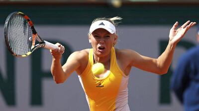 Caroline Wozniacki of Denmark plays a shot to Julia Goerges of Germany during their women's singles match at the French Open tennis tournament at the Roland Garros stadium in Paris, France, May 28, 2015. REUTERS/Vincent Kessler