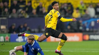 Jude Bellingham is tackled by Chelsea's Mykhailo Mudryk. AP