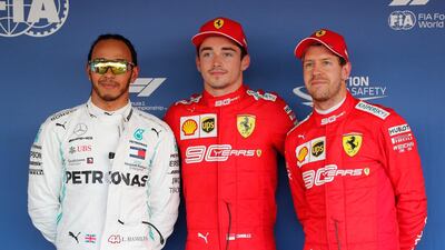 Lewis Hamilton of Mercedes, left, first-placed Charles Leclerc of Ferrari and third-placed Sebastian Vettel after qualifying at the Sochi Autodrom circuit. EPA