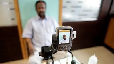 New measures, including allowing company representatives to collect the cards on behalf of groups of employees, will help to reduce the waiting time to 10 days, say officials.