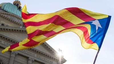 The flag of Catalonia waving during a demonstration in support of independence in in Bern, Switzerland. Peter Klaunzer / EPA