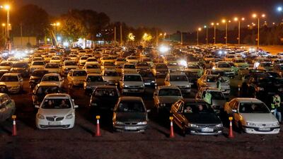Iranians sit in their vehicles while taking part in a religious ceremony in Tehran's Eram park in the Iranian capital. AFP