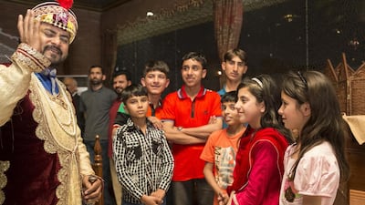 Children from the conflict-torn Swat Valley in Pakistan are entertained at the Lal Qila restaurant on their first visit to Dubai. Antonie Robertson / The National