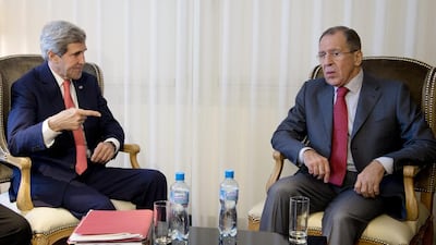 The US secretary of state John Kerry, left, and Russia's foreign minister Sergei Lavrov prior to their meeting in Geneva on Saturday discuss Iran's nuclear programme. AP Photo