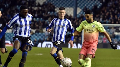 Manchester City's Riyad Mahrez, right, in action against Wednesday. AP