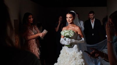 The dress was designed by the bride's mother, Zeena Zaki. Instagram/ @raniafawazz