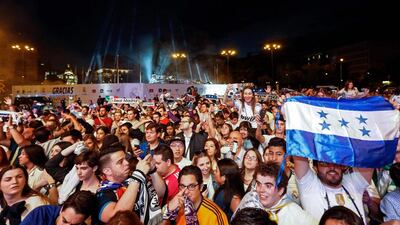 Real Madrid fans celebrate the team’s win on Plaza Cibeles in Madrid on May 21, 2017. Oscar del Pozo / AFP