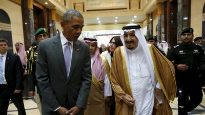 US President Barack Obama walks with Saudi King Salman at Erga Palace upon arriving for a summit meeting in Riyadh on Wednesday. Kevin Lamarque / Reuters