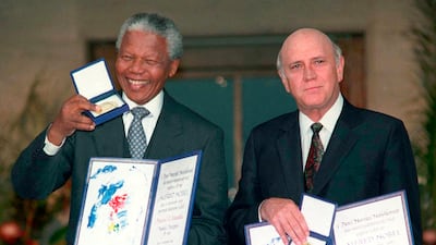 South African President Nelson Mandela and Vice President FW de Klerk with their Nobel Peace Prize medals and diplomas in Oslo, December 10, 1993. De Klerk, who presided over the end of the apartheid regime, died on November 11, 2021. AP Photo