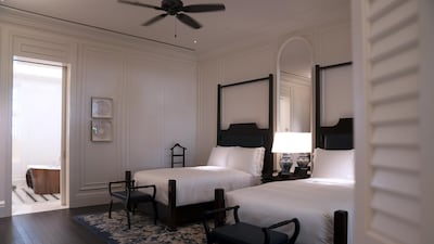 Beds stand inside a Palm Court Suite at the Raffles Hotel. Bloomberg