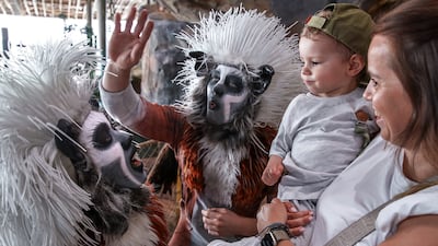 Visitors to SeaWorld Abu Dhabi interact with the cotton top-tamarin performers