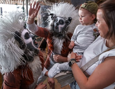 Cotton top-tamarin performers Benjamin Ratcliffe and Andres Lin Fan meet young guests at the park. Victor Besa / The National