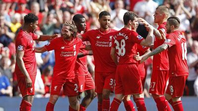 Joe Allen celebrates with teammates after scoring for Liverpool on Sunday in the Premier League. Carl Recine / Action Images / Reuters / May 8, 2016