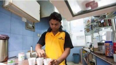 Zayed Thottungal, 20, from Kerela working at Malik Al Karak Cafeteria early in the morning.