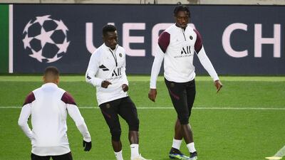 Idrissa Gana Gueye and Moise Kean train at Camp Nou. AFP