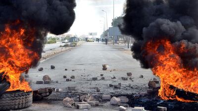 Tyres set on fire by Tunisians on January 21, 2016, in solidarity with protests in Kasserine, block the road in the southeastern town of Ben Guerdane. Protests over unemployment and poverty in central Tunisia have raised fears of growing social unrest five years after the country’s revolution ignited by similar grievances. Fathi Nasri / Agence France-Presse