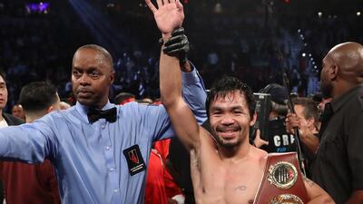Manny Pacquiao of the Philippines poses after his unanimous-decision victory over Jessie Vargas. Christian Petersen / Getty Images