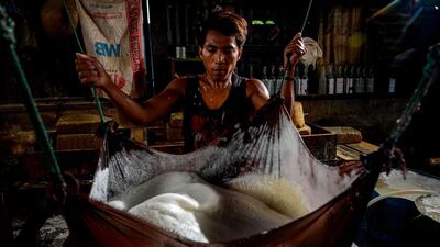 A worker makes tofu from soybeans at a facility in Banda Aceh, Indonesia, on October 12. Chaideer Mahyuddin / AFP
