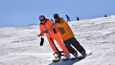 Medical supports allow disabled skiers to ski upright. Philippe Royer