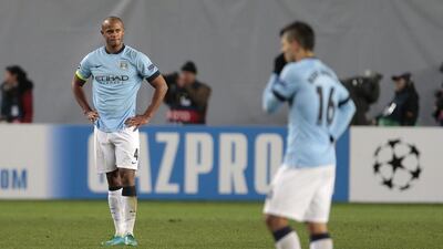 Manchester City's Vincent Kompany, left, reacts after CSKA Moscow's Bebras Natcho scores a penalty in the clubs' 2-2 draw in the Russian capital on Tuesday night in Champions League group play. Ivan Sekretarev / AP
