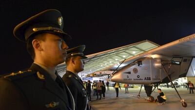 Chinese policemen stand guard next to the Solar Impulse 2 plane after it landed at Nanjing Lukou International Airport. Reuters