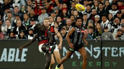 Anthony McDonald-Tipungwuti of the Bombers kicks a goal. Getty